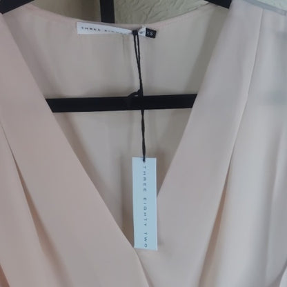 Chic Cream Blouse with Elegant Design