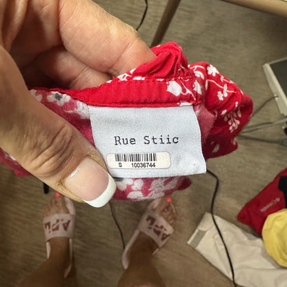 Red Asymmetrical Sleeveless Blouse with Ruffled Tie Front