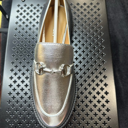 129 133. Silver Metallic Flats with Horsebit Detail