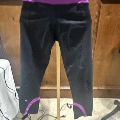 SIZE 6 Lululemon Athletica Black and Pink Leggings